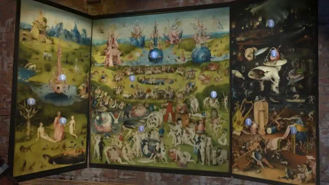 A view of The Garden of Earthly Delights with small information callouts visible.
