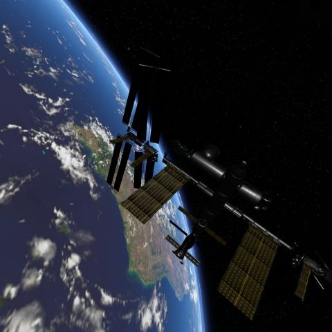 A view of earth with a space station in front of it
